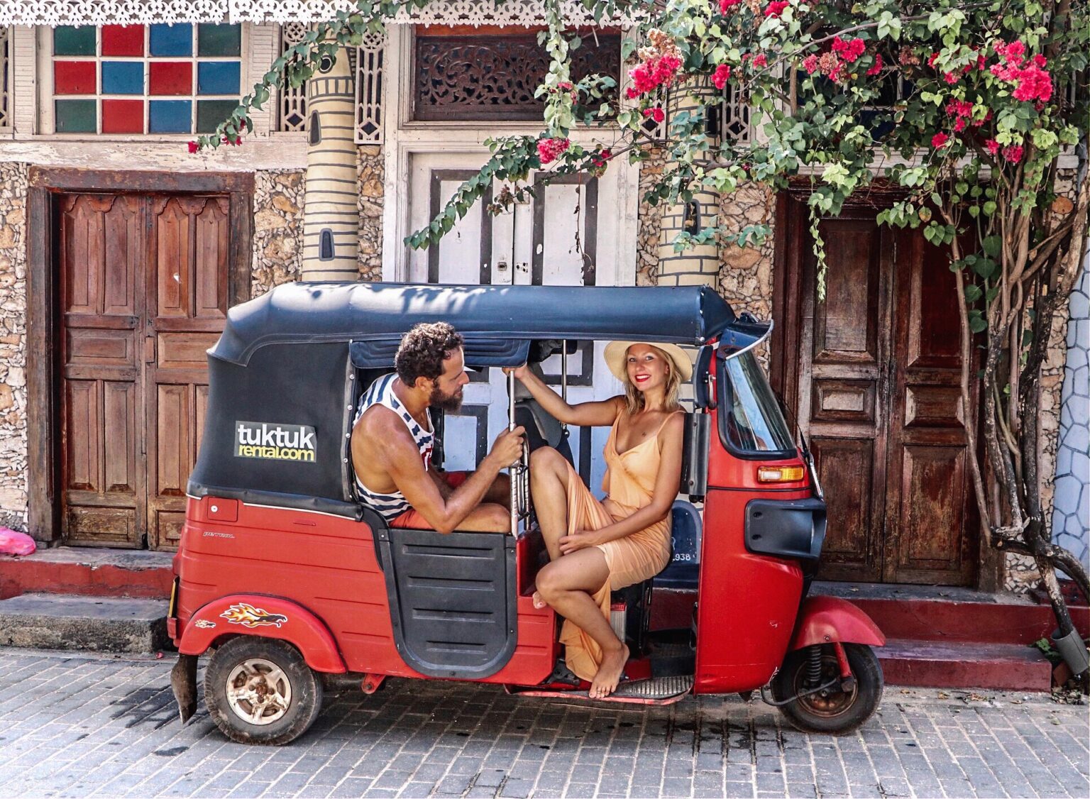 Regular tuktuk and a couple in Galle